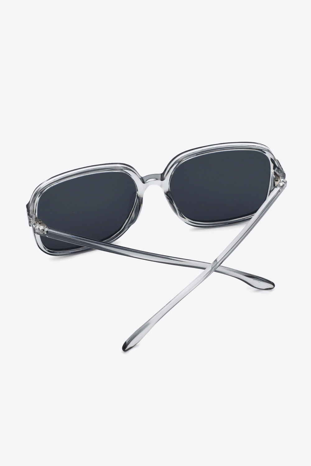 Oversized square sunglasses with UV400 protection and polycarbonate frame.