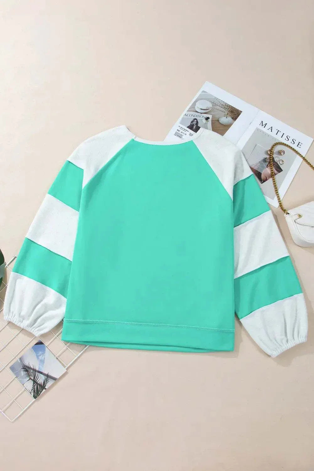 Plus size color block long sleeve sweatshirt with exposed seams.