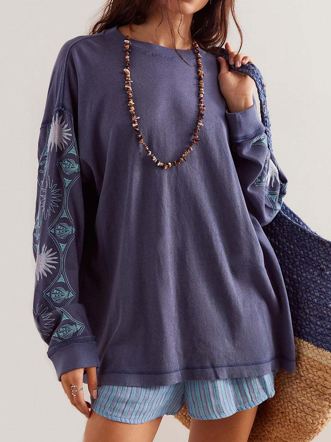 Embroidered seashell round neck long sleeve sweatshirt in navy blue.