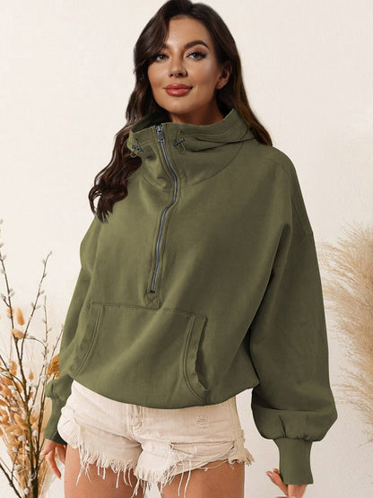 Half zip dropped shoulder hoodie in olive green with drawstring and pocket, no stretch, polyester-rayon blend.