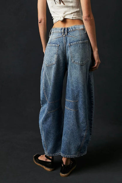 Wide leg barrel jeans with pockets, back view.