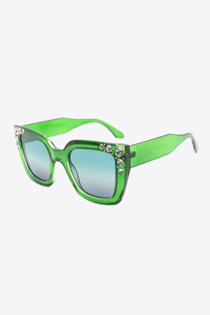 Oversized rhinestone sunglasses with green polycarbonate wayfarer frame and UV400 protection.