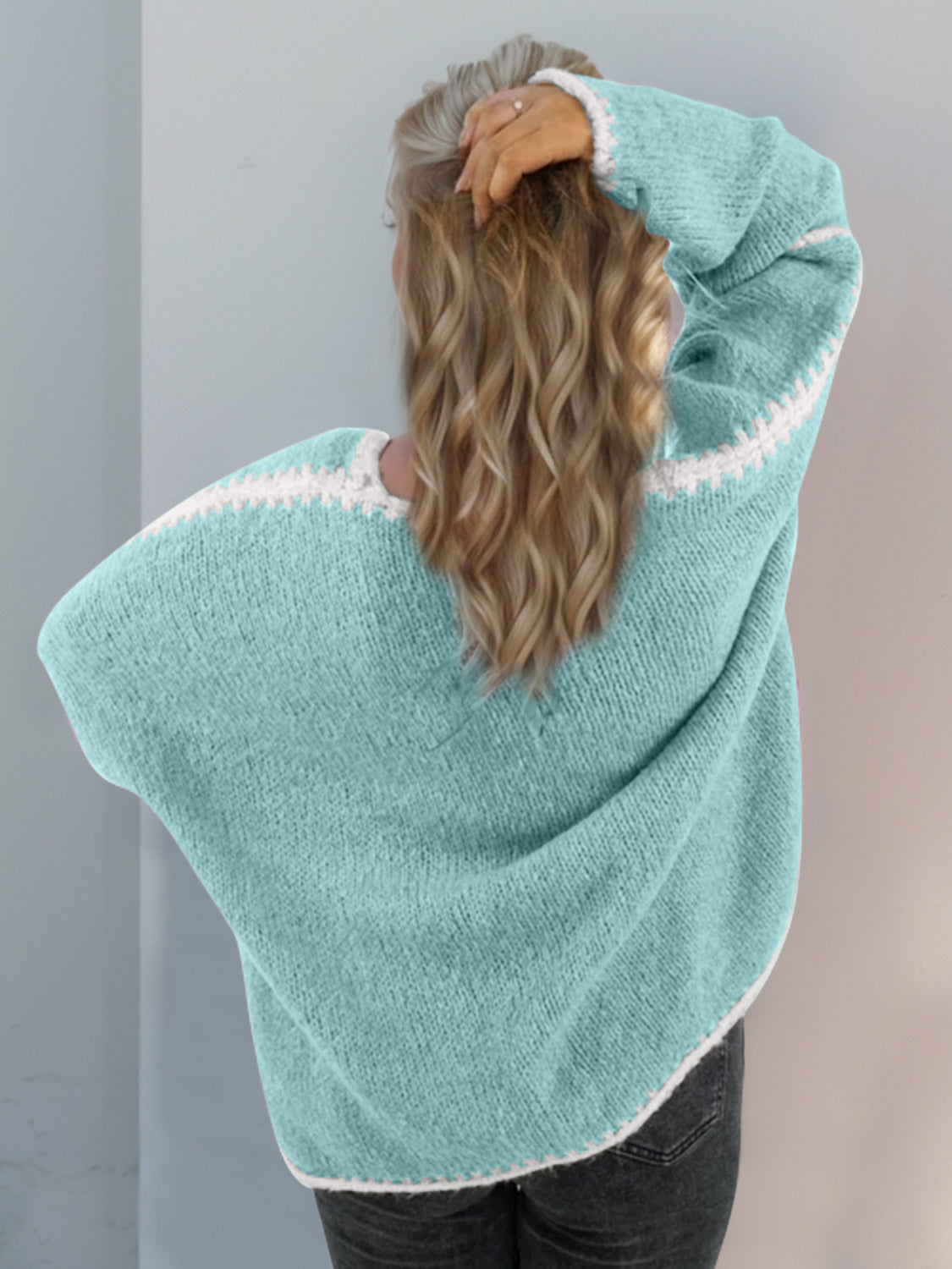 Blue super cozy open cardigan with slightly stretchy polyester material.