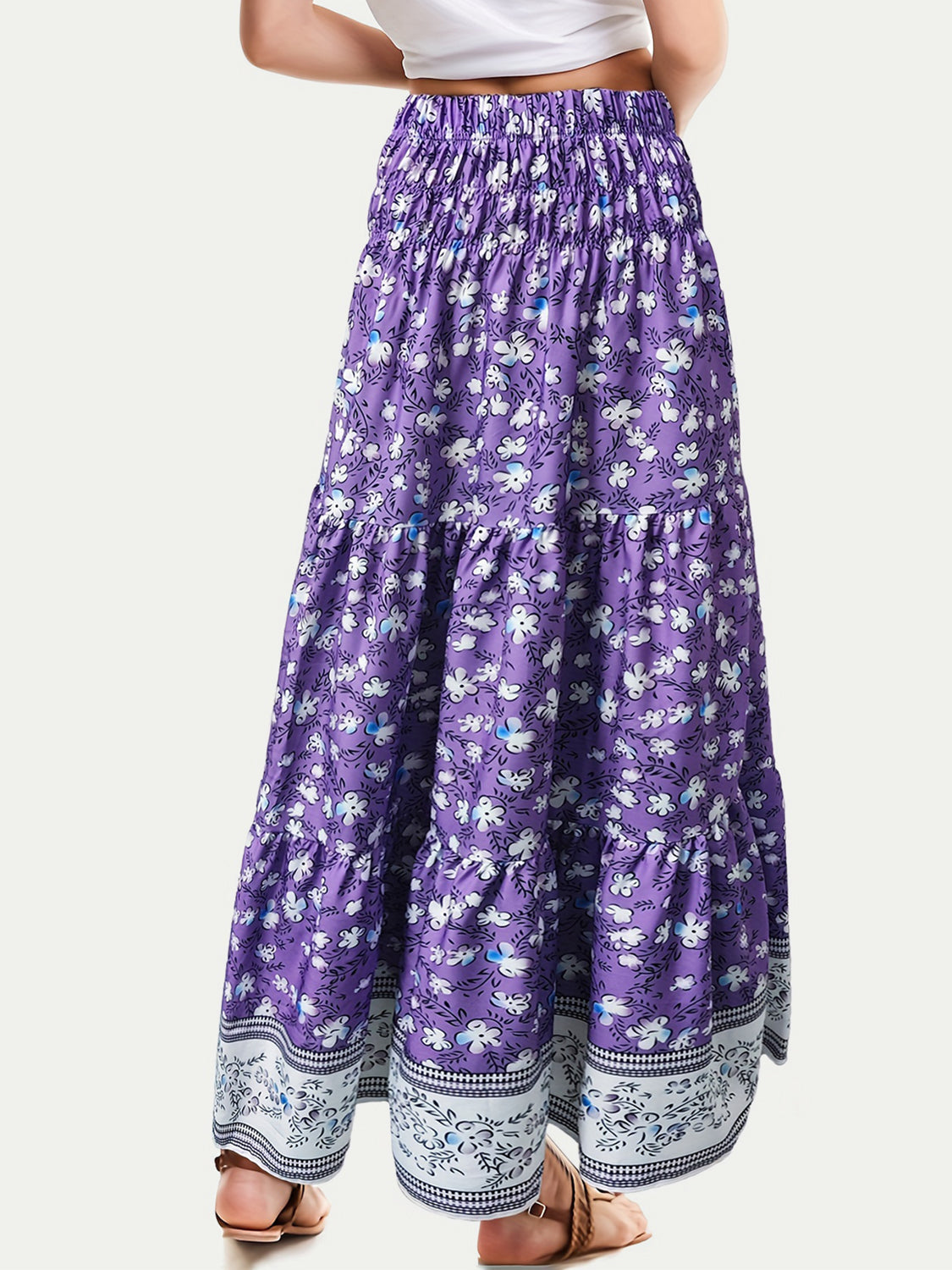 Purple tiered printed elastic waist skirt with floral design, ruched style, 100% polyester.