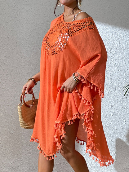 Tassel cutout scoop neck cover-up dress in orange with semi-sheer fabric and decorative tassels.