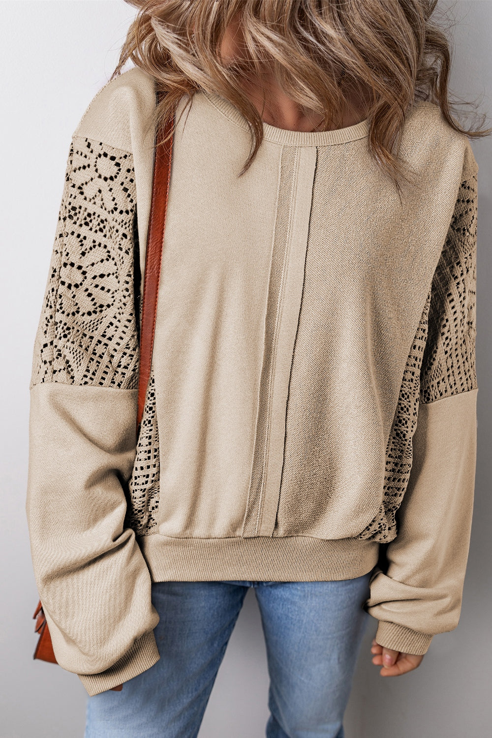 Boho crochet round neck long sleeve sweatshirt with cutout design.