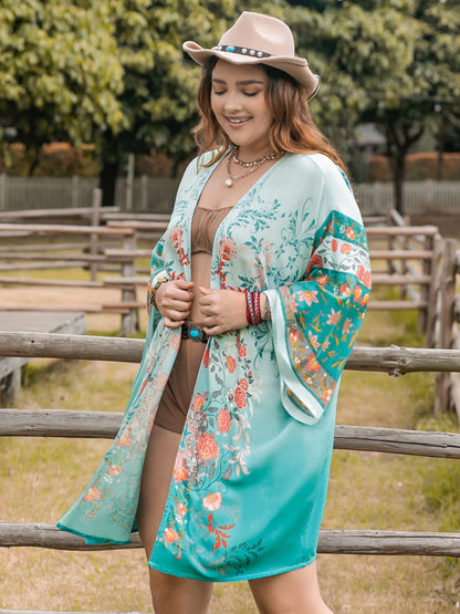 Plus size printed open front long sleeve cover up in turquoise floral design.