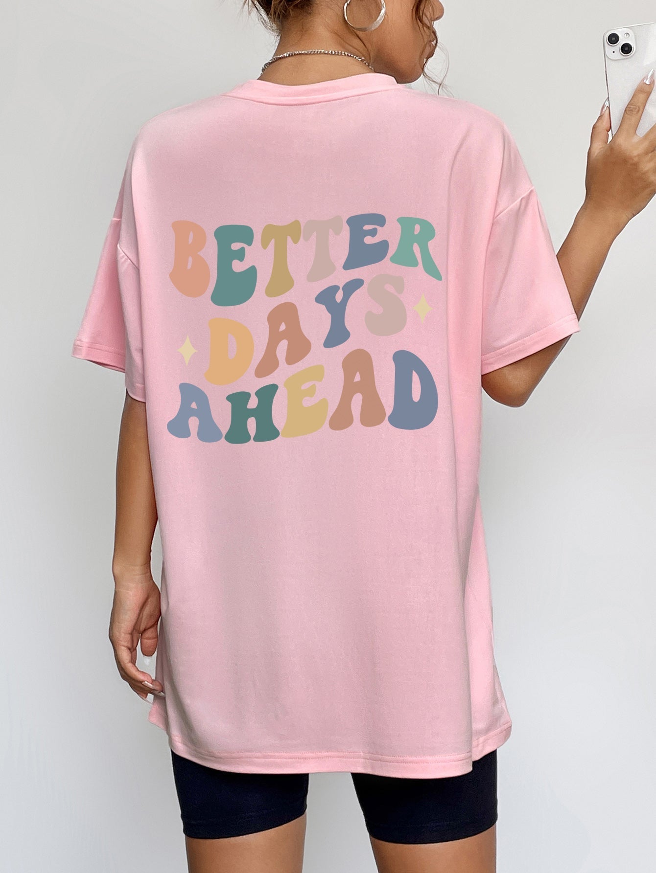 Better Days Ahead Graphic T-Shirt in pink with multicolored text, 100% polyester, slightly stretchy.