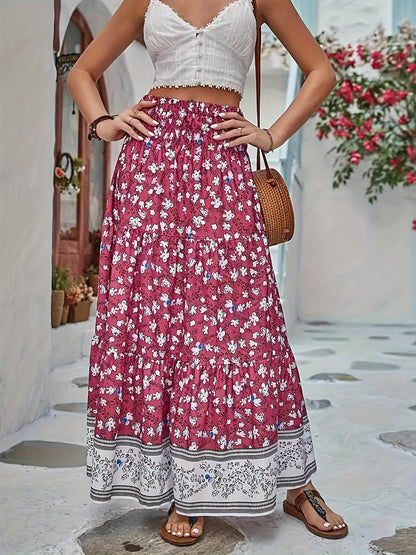 Tiered printed elastic waist skirt with floral design.