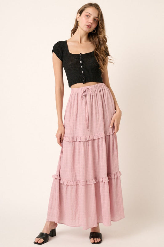 Dusty pink drawstring high waist frill skirt worn by a model.