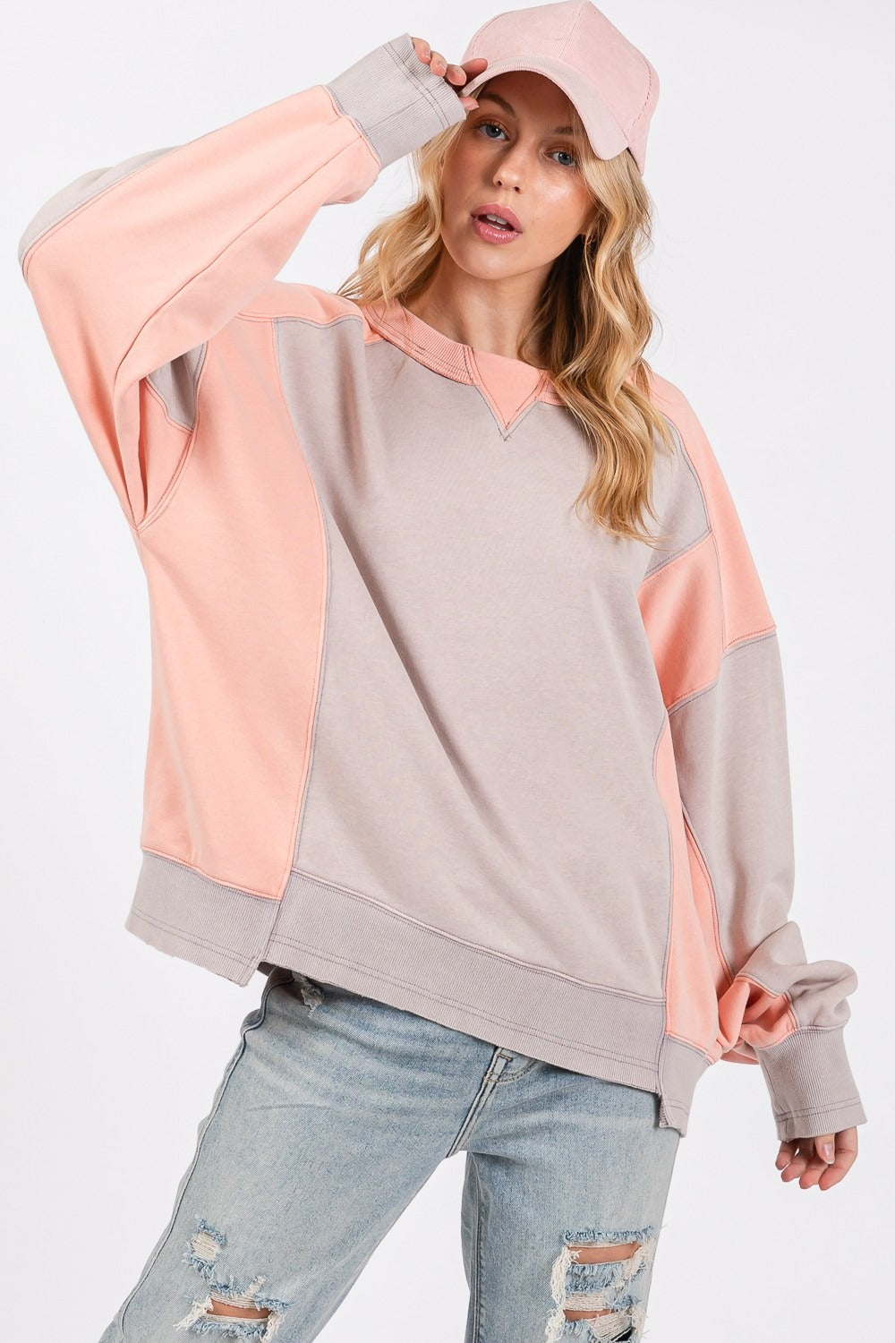 Color block round neck relaxed fit sweatshirt with dropped sleeves and ribbed trim.