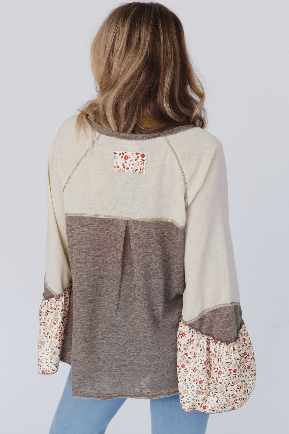 Floral Half Button Long Sleeve T-Shirt with multicolored design and floral accents.