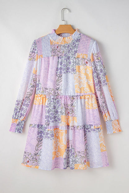 Frill printed mock neck long sleeve mini dress in pastel colors on hanger.