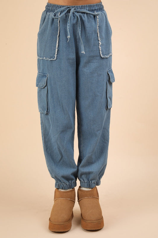 Washed drawstring jogger cargo jeans with elastic waist and side pockets.