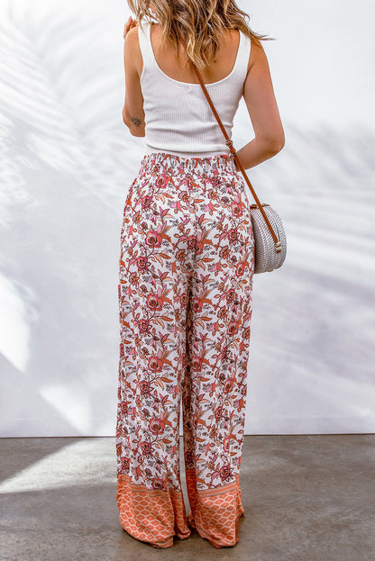 Floral Bohemian pleated wide leg pants on model.