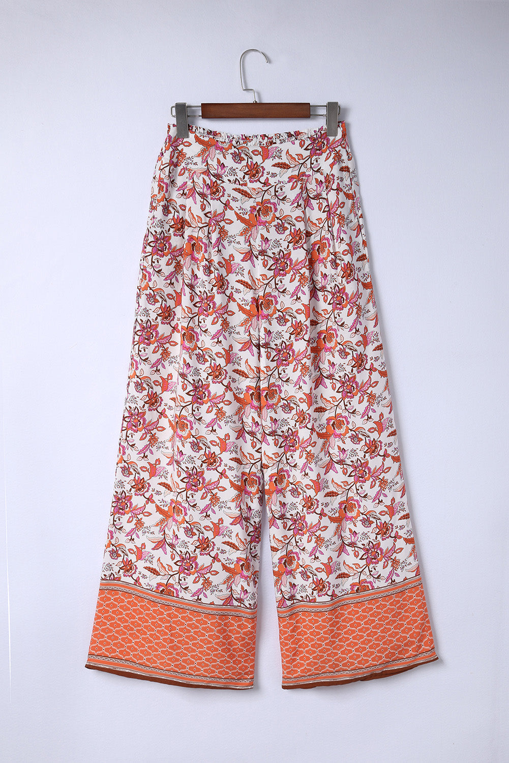 Bohemian pleated wide leg pants with floral pattern and straight hem.