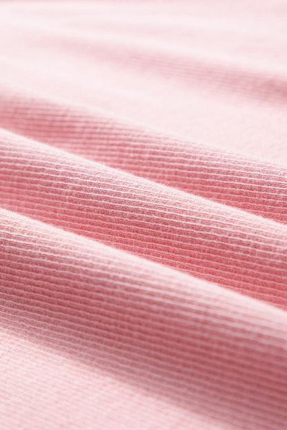 Round neck long sleeve sweatshirt fabric close-up.