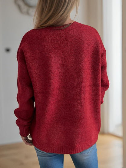 Cherry round neck long sleeve sweater, slightly stretchy, polyester-acrylic blend.