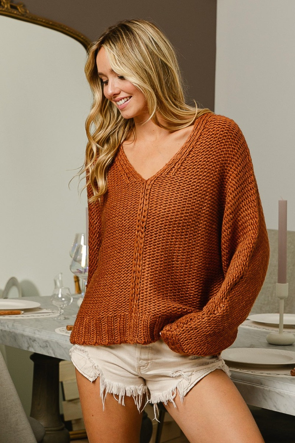 Cinnamon V Neck Cable Sweater in cozy knit fabric, featuring elegant cable knit design.