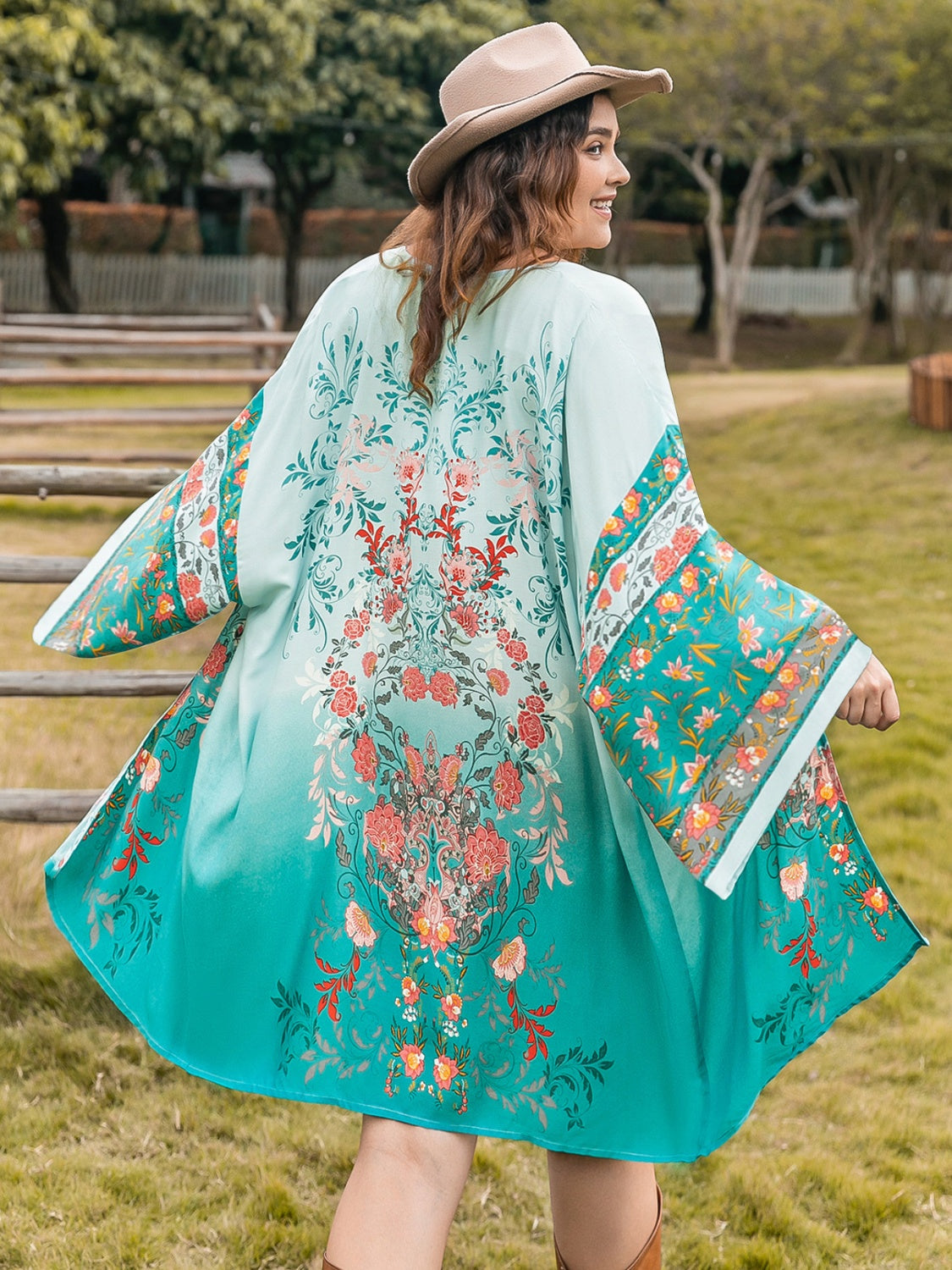 Plus size printed open front long sleeve cover up in vibrant colors.