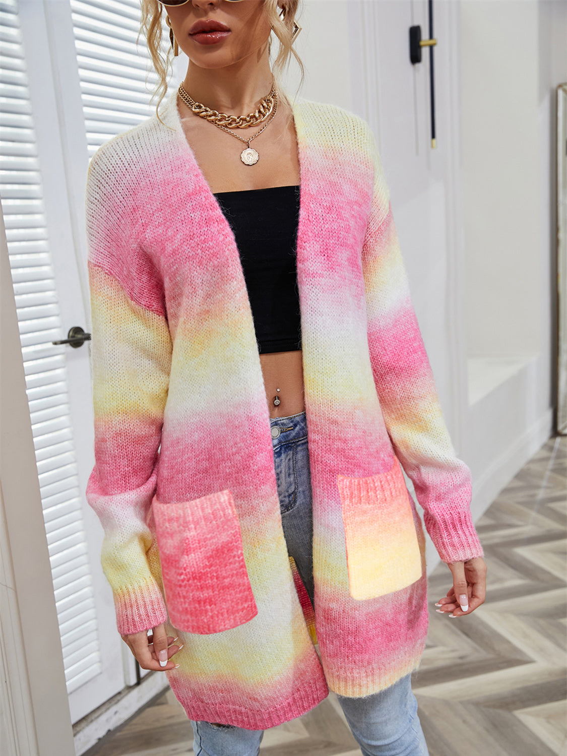 Rainbow pocketed open front gradient cardigan with pastel colors and long sleeves.