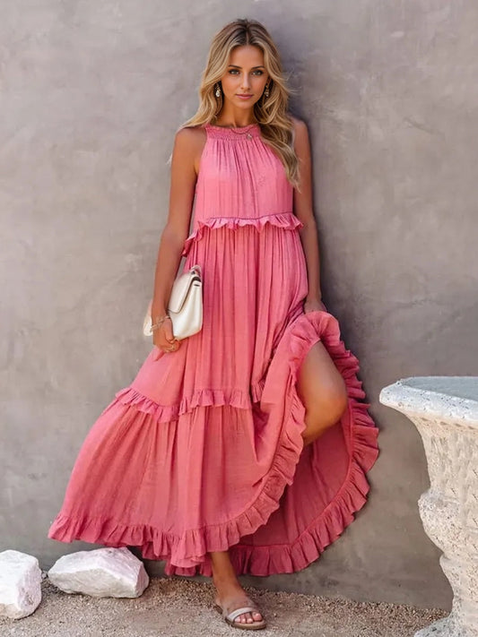 Ruffled sleeveless tiered maxi dress with pockets in pink, featuring a high-low hem and smocked detailing.