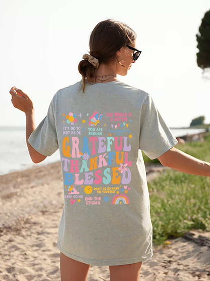 Grateful Thankful Blessed Graphic T-Shirt with colorful design on the back, slightly stretchy polyester fabric.