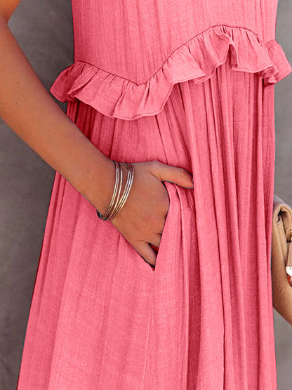 Ruffled sleeveless tiered maxi dress with pockets in pink fabric.