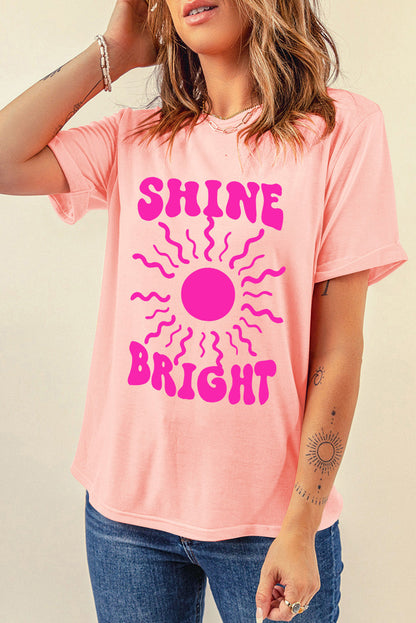 Shine Bright Graphic T-Shirt in pink featuring bold design and casual style.