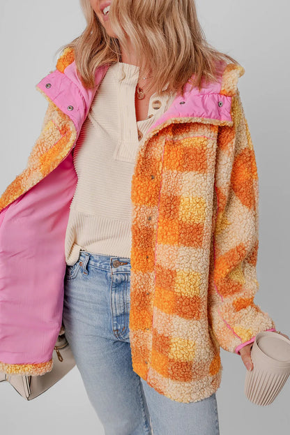 Plaid long sleeve hooded jacket with pink lining and orange check pattern.