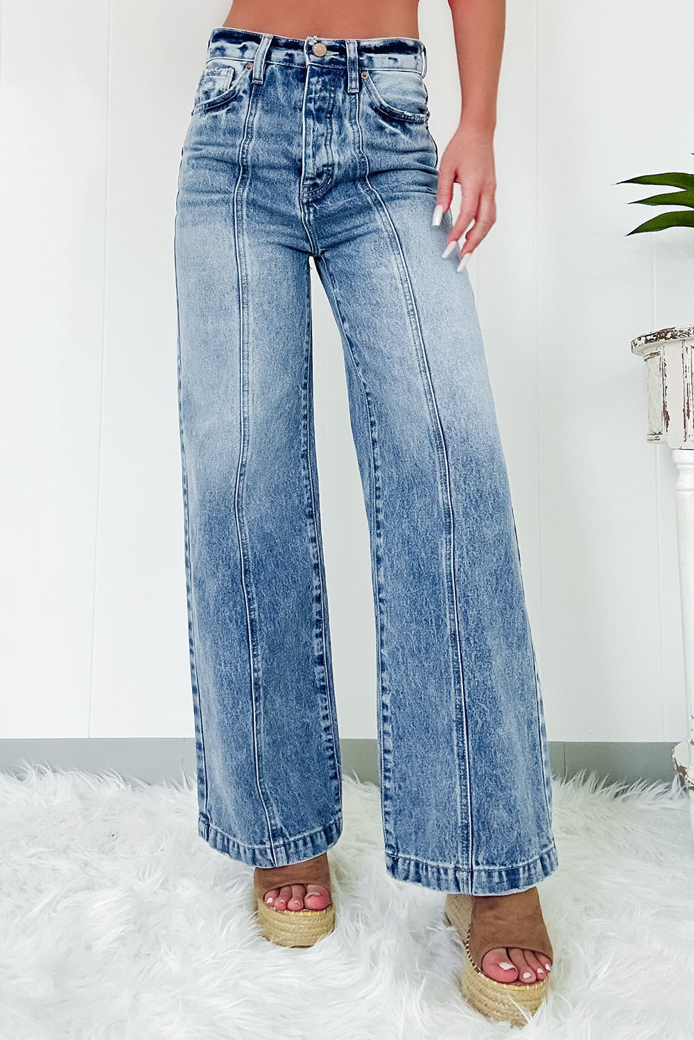 Dusk blue wide leg high waist jeans with central seam detailing and deep pockets.