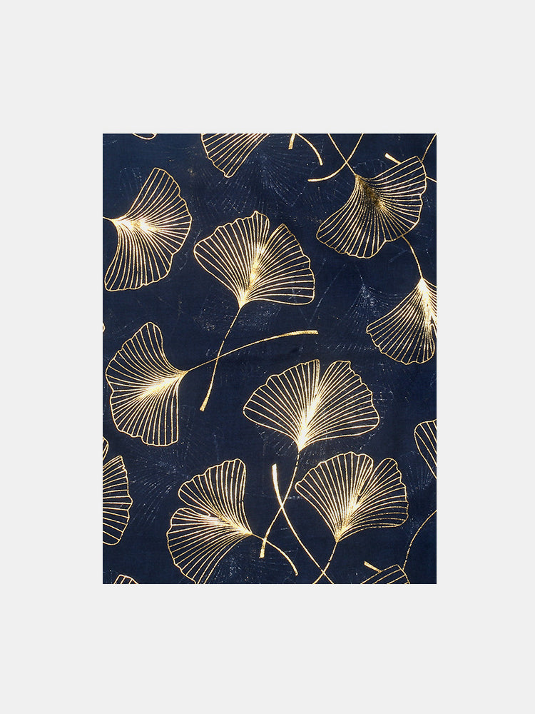 Ginkgo leaf polyester scarf with gold pattern on navy background.