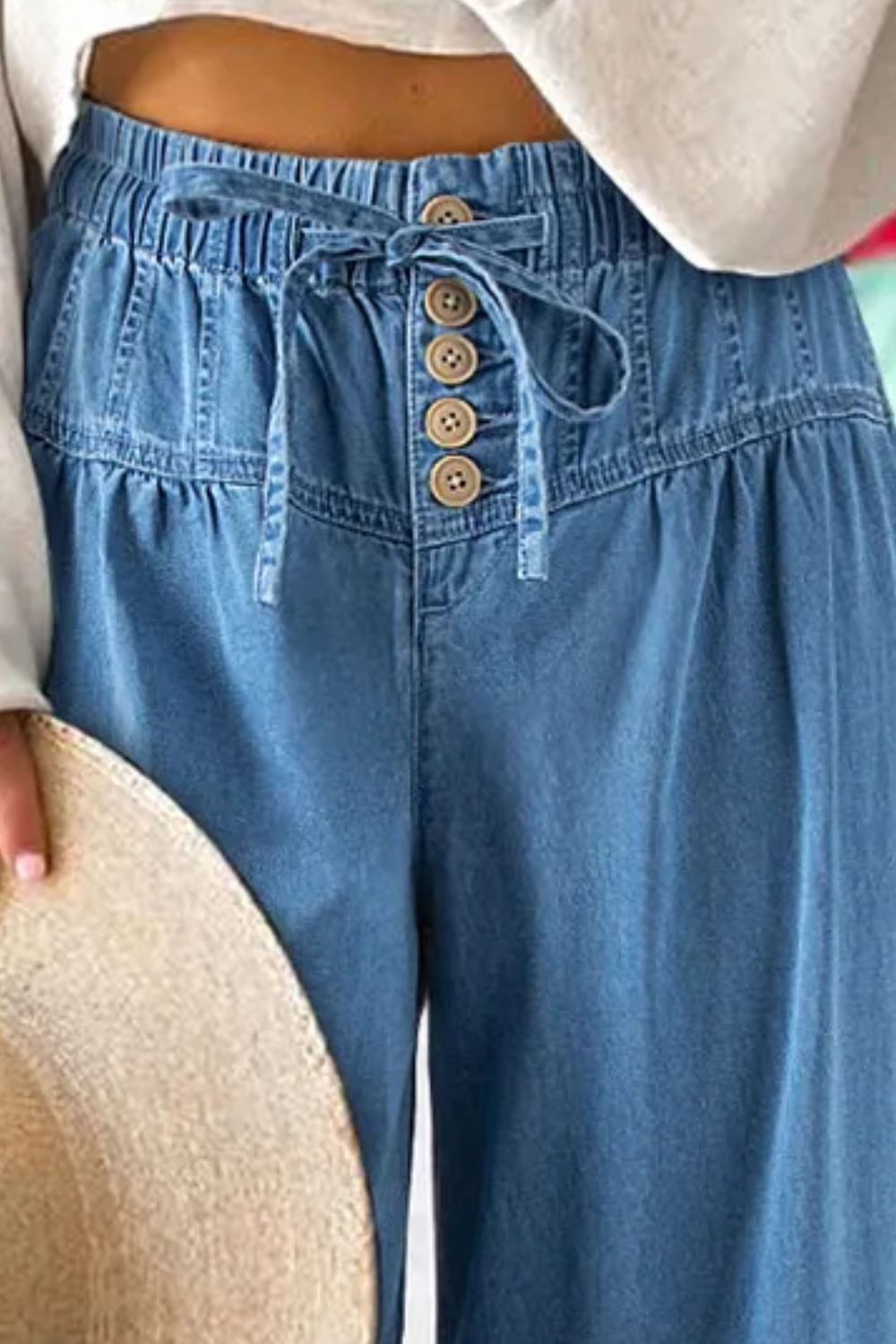 Drawstring elastic waist wide leg jeans in blue denim.