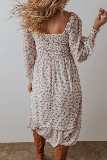 Smocked floral square neck long sleeve midi dress with no stretch and opaque fabric.