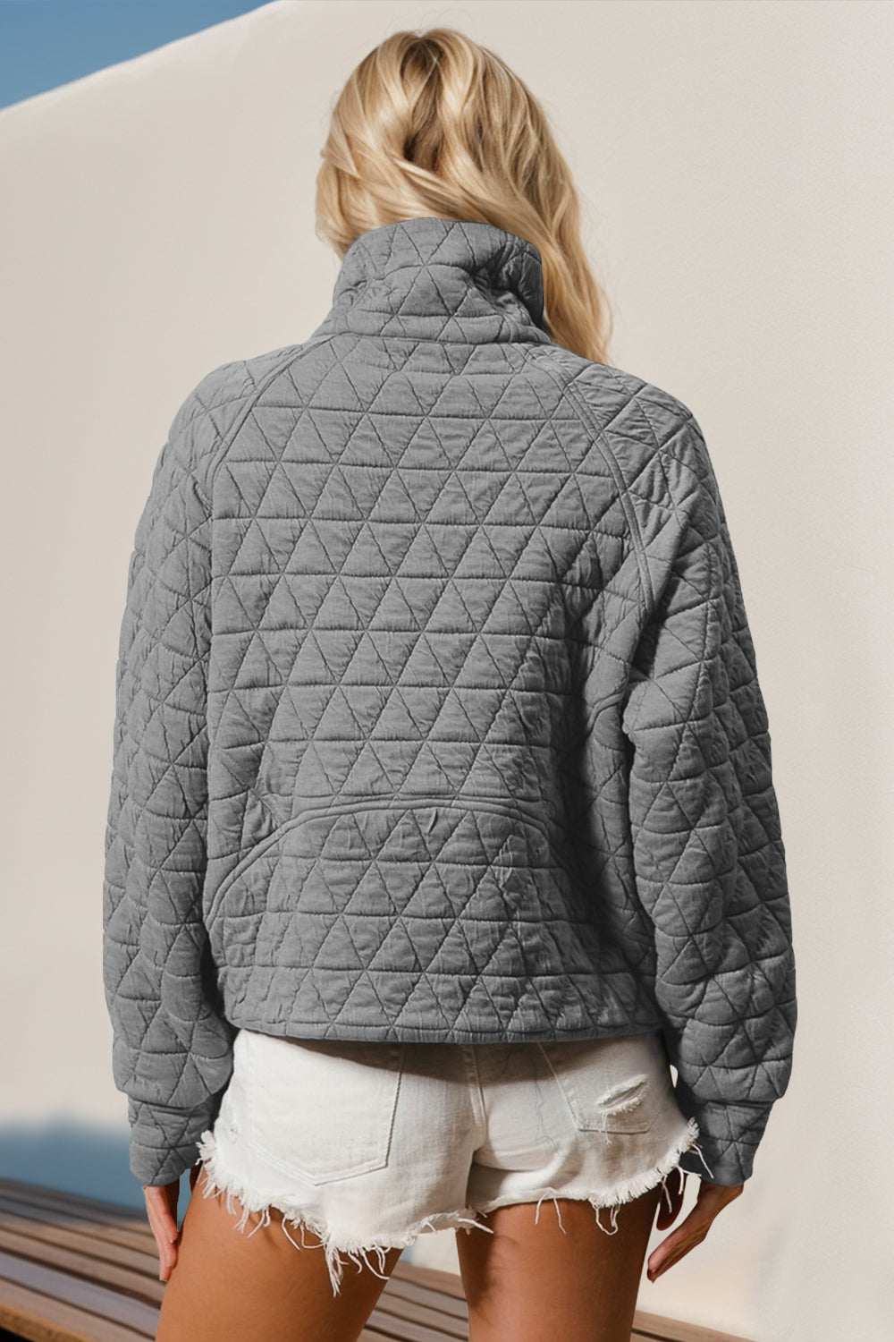 Half zip long sleeve quilted sweatshirt with pocket, gray, slightly stretchy fabric.