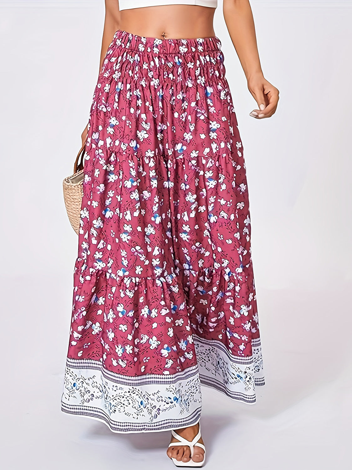 Tiered printed elastic waist skirt with floral design, 100% polyester.