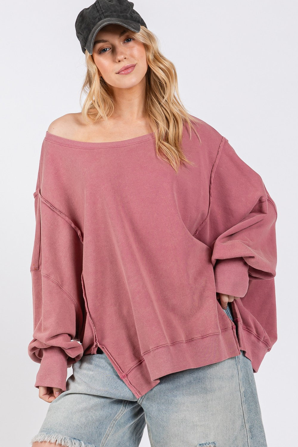 Mineral Wash Side Slit Oversized Sweatshirt with exposed seams and scoop neck.