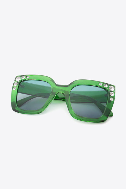 Oversized rhinestone sunglasses with green polycarbonate wayfarer frame and UV400 protection.