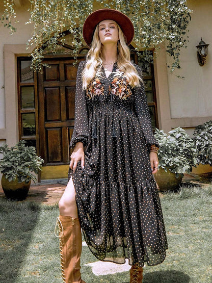 Embroidered polka dot tie neck long sleeve midi dress with floral detail and tiered skirt.