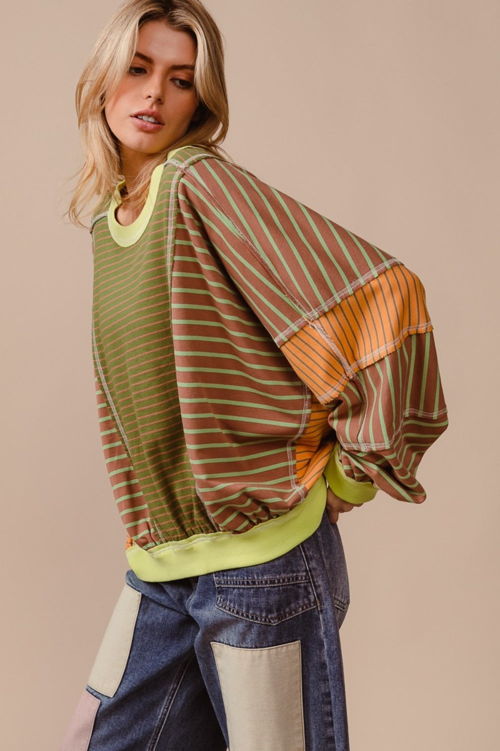 Color Block Striped Round Neck Sweatshirt with bold stripes and casual design.