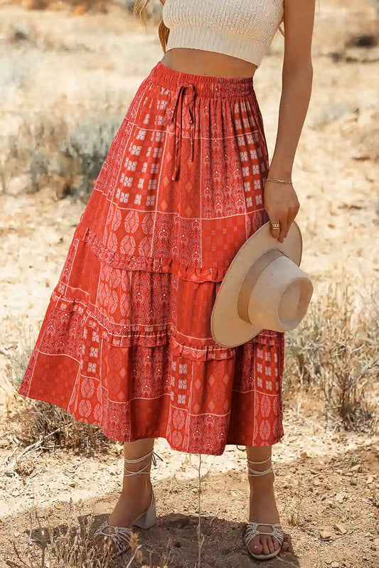 Bohemian mix print long flared skirt in red with chic boho vibe and ruffled detail.